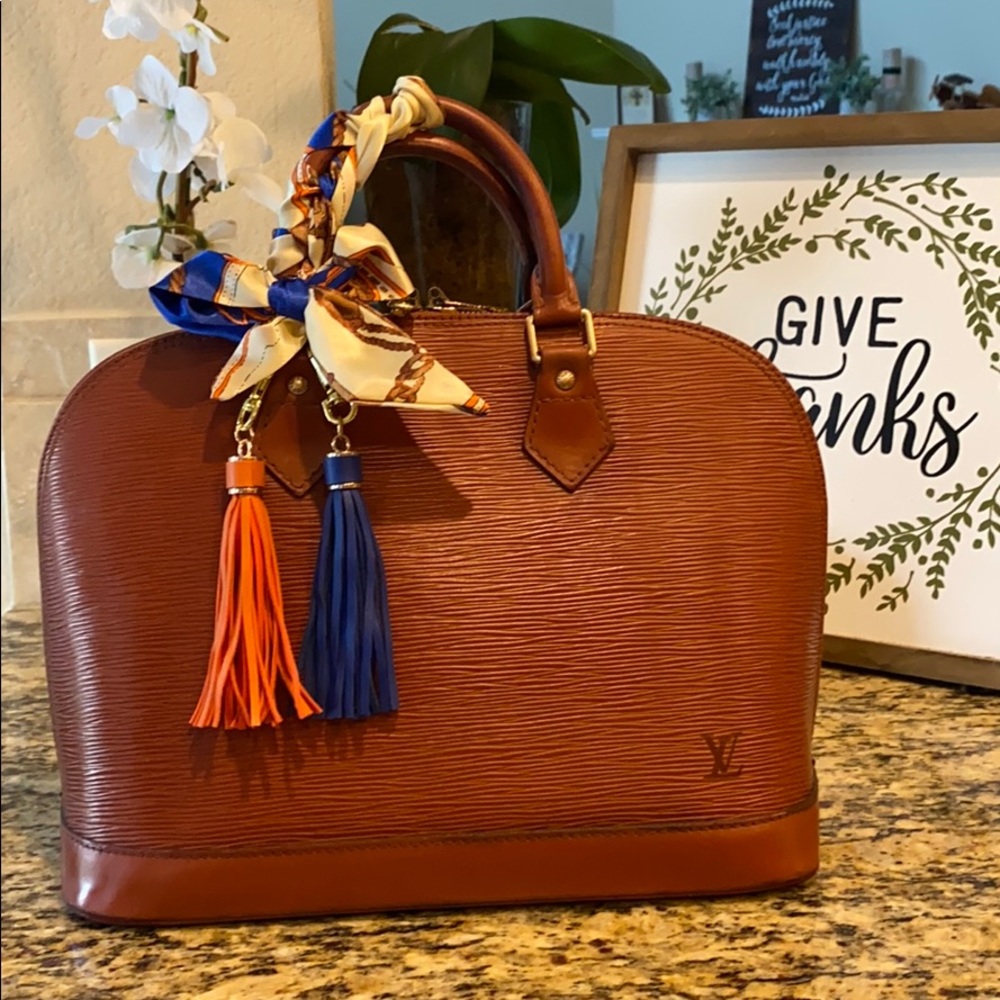 Louis Vuitton Brown (orangy-brown) Alma PM.